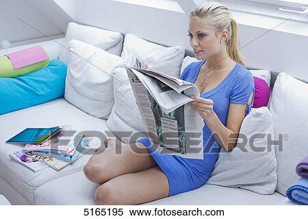 Young woman with ipad and newspaper View Large Photo Image Stock Photography - Young woman with ipad and newspaper . Fotosearch
