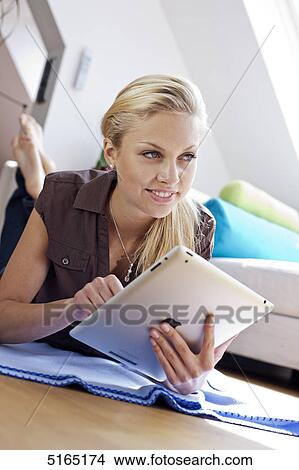 Young woman with ipad View Large Photo Image Picture - Young woman with ipad . Fotosearch