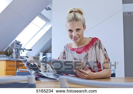 Young woman with ipad View Large Photo Image Picture - Young woman with ipad . Fotosearch