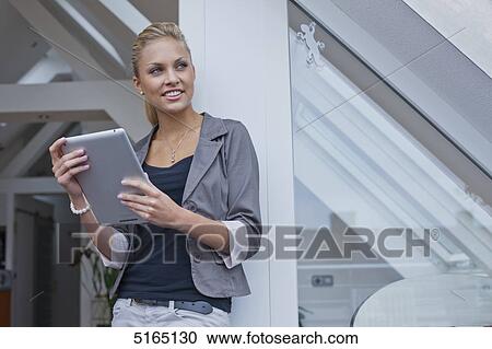 Young woman with ipad View Large Photo Image Stock Image - Young woman with ipad . Fotosearch