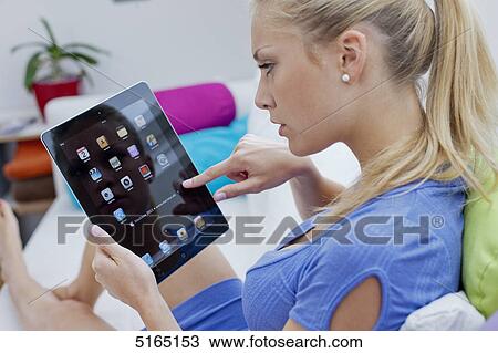 Young woman with ipad View Large Photo Image Stock Image - Young woman with ipad . Fotosearch