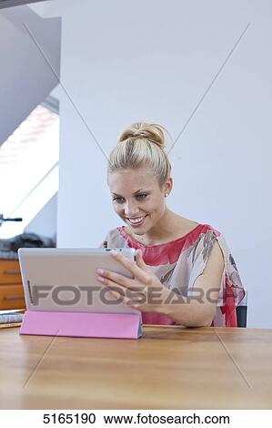 Young woman with ipad View Large Photo Image Stock Image - Young woman with ipad . Fotosearch