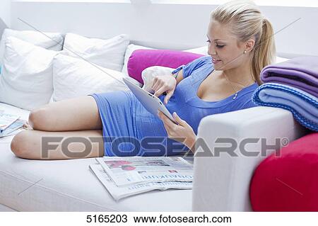 Young woman with ipad View Large Photo Image Stock Image - Young woman with ipad . Fotosearch