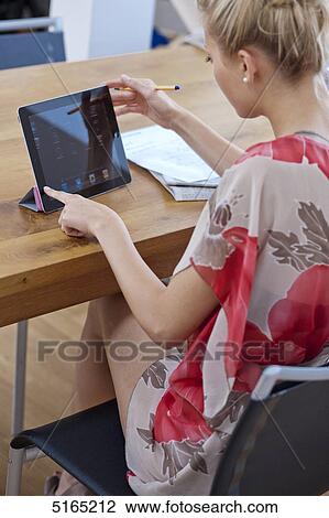 Young woman with ipad View Large Photo Image Stock Image - Young woman with ipad . Fotosearch