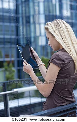 Young woman with ipad View Large Photo Image Stock Image - Young woman with ipad . Fotosearch