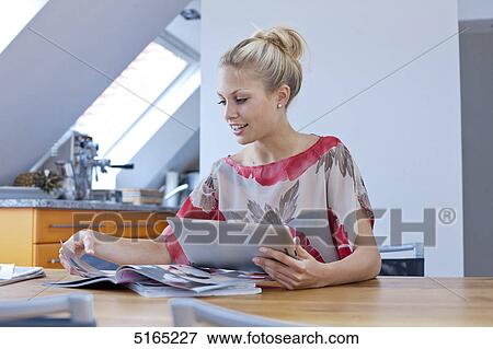 Young woman with ipad View Large Photo Image Stock Photo - Young woman with ipad . Fotosearch