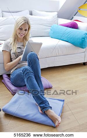 Young woman with ipad View Large Photo Image Stock Photograph - Young woman with ipad . Fotosearch