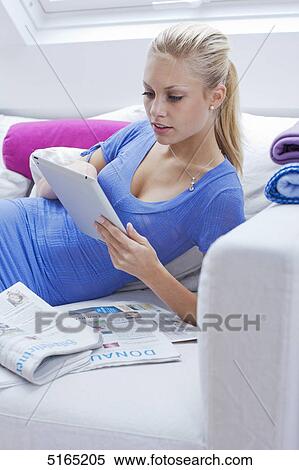 Stock Photography - Young woman with ipad . Fotosearch