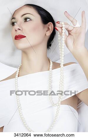 Picture - Young woman with white hat, portrait . Fotosearch
