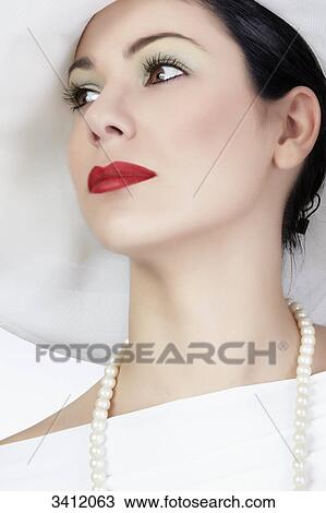 Young woman with white hat, portrait View Large Photo Image Stock Image - Young woman with white hat, portrait . Fotosearch