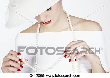 Young woman with white hat, portrait View Large Photo Image Stock Photography - Young woman with white hat, portrait . Fotosearch