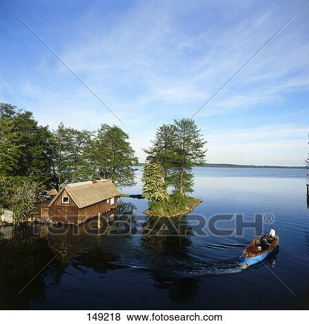Aerial view of boat in river near hut, Schwerin, Mecklenburg-West Pomerania, Germany View Large Photo Image Stock Photo - Aerial view of boat in river near hut, Schwerin, Mecklenburg-West Pomerania, Germany . Fotosearch