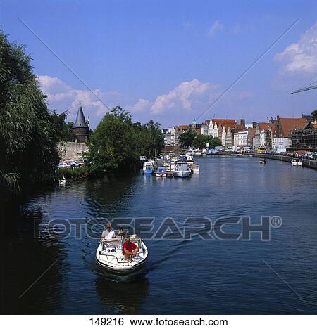 Aerial view of motor boat in river, Luebeck, Germany View Large Photo Image Stock Photograph - Aerial view of motor boat in river, Luebeck, Germany . Fotosearch