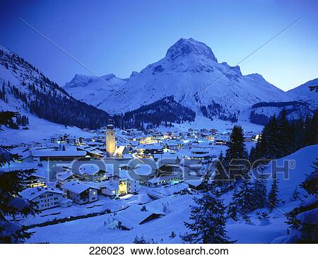 Aerial view of village on snow-covered landscape lit up at night, Lech am Arlberg, Vorarlberg, Austria View Large Photo Image Stock Image - Aerial view of village on snow-covered landscape lit up at night, Lech am Arlberg, Vorarlberg, Austria . Fotosearch