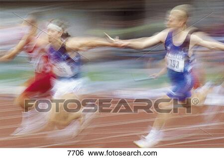 Blurred view of men running on track in relay race  View Large Photo Image Stock Photograph - Blurred view of men running on track in relay race . Fotosearch