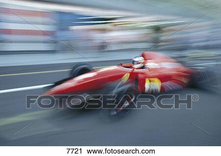 Blurred view of racecar in motion on track View Large Photo Image Stock Image - Blurred view of racecar in motion on track . Fotosearch