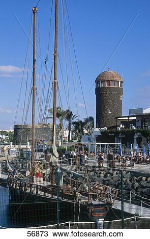 Stock Image - Boat moored near a pier . Fotosearch