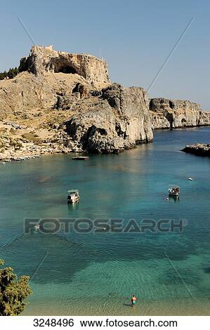 Stock Photograph - Boats in the bay of Lindos, Rhodes, Greece, elevated view . Fotosearch