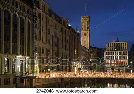 Stock Photo - Buildings lit up at dusk, Bleichenfleet, Hamburg, Germany . Fotosearch