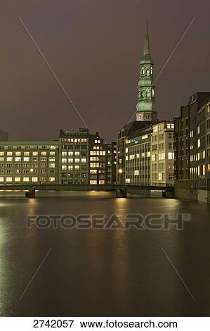 Stock Photo - Buildings lit up at dusk, Katharinenkirche, Hamburg, Germany . Fotosearch