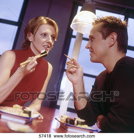 Businessman and businesswoman talking to each other in restaurant View Large Photo Image Stock Photo - Businessman and businesswoman talking to each other in restaurant . Fotosearch