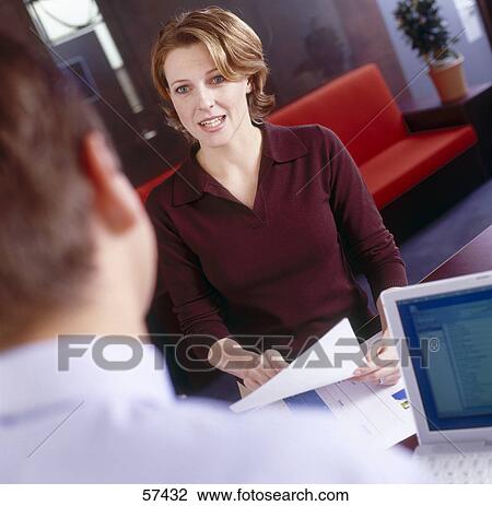Businesswoman talking to businessman View Large Photo Image Stock Image - Businesswoman talking to businessman . Fotosearch