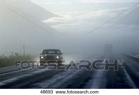 Stock Image - Car on highway, Glenn Highway, Alaska, USA . Fotosearch
