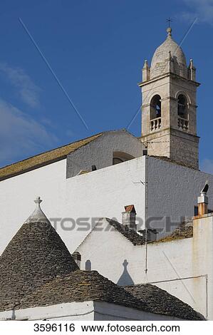 Church and roof of a trullo, Alberobello, Italy View Large Photo Image Stock Photograph - Church and roof of a trullo, Alberobello, Italy . Fotosearch