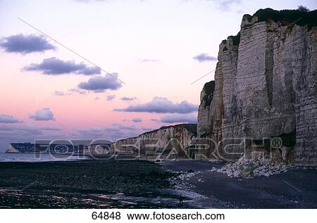 Cliffs at the coast during dusk, Yport, Normandie, France View Large Photo Image Stock Photo - Cliffs at the coast during dusk, Yport, Normandie, France . Fotosearch