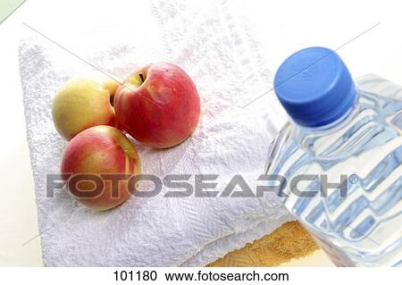 Close-up of apples on towel and water bottle View Large Photo Image Stock Image - Close-up of apples on towel and water bottle . Fotosearch