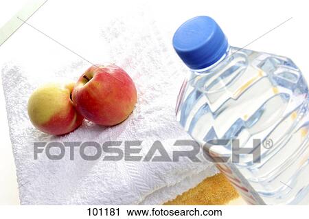 Close-up of apples on towel and water bottle View Large Photo Image Stock Image - Close-up of apples on towel and water bottle . Fotosearch