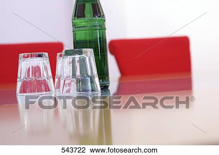 Close-up of bottle and empty glass View Large Photo Image Stock Image - Close-up of bottle and empty glass . Fotosearch