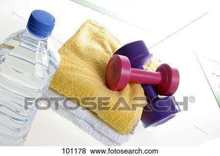 Close-up of dumbbells and towels with water bottle View Large Photo Image Stock Photo - Close-up of dumbbells and towels with water bottle . Fotosearch