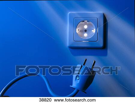 Stock Image - Close-up of electric plug and outlet . Fotosearch