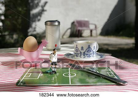 Close-up of figurine of soccer player and table knife View Large Photo Image Picture - Close-up of figurine of soccer player and table knife . Fotosearch