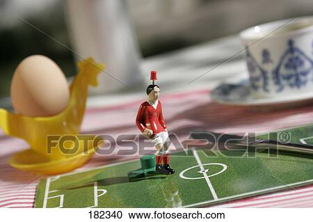Stock Image - Close-up of figurine of soccer player . Fotosearch