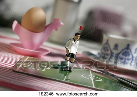 Stock Photograph - Close-up of figurine of soccer player . Fotosearch