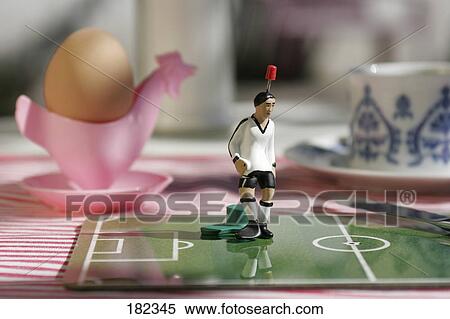 Stock Photography - Close-up of figurine of soccer player . Fotosearch