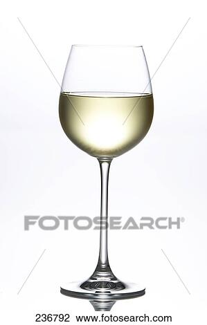 Stock Image - Close-up of glass of white wine . Fotosearch