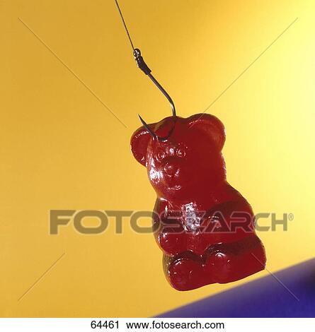 Stock Image - Close-up of gummy bear on fishing hook . Fotosearch
