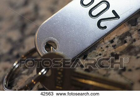 Stock Image - Close-up of hotel room key . Fotosearch