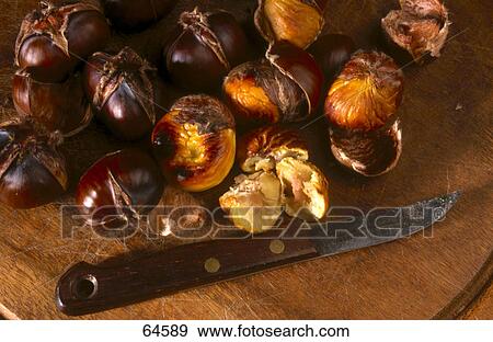 Stock Photo - Close-up of knife and chestnuts . Fotosearch