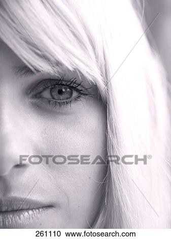 Stock Image - Close-up of mid adult woman looking serious . Fotosearch
