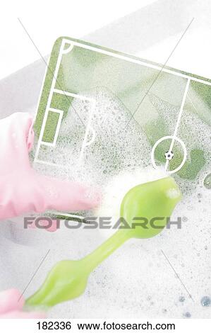 Close-up of person washing tray with brush View Large Photo Image Stock Photograph - Close-up of person washing tray with brush . Fotosearch