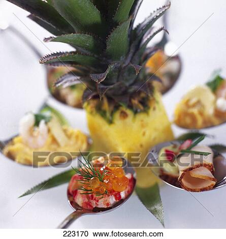 Stock Image - Close-up of prawn and caviars on spoon . Fotosearch