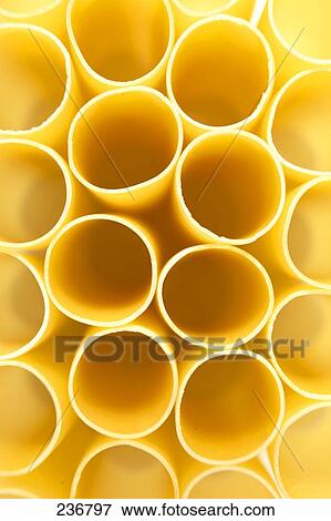 Stock Photo - Close-up of raw tubular pasta . Fotosearch