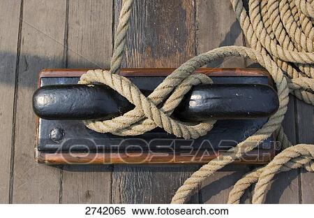 Stock Photography - Close-up of rope secured to cleat on dock, Hamburg, Germany . Fotosearch