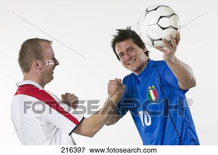 Close-up of two male soccer fans smiling View Large Photo Image Stock Photo - Close-up of two male soccer fans smiling . Fotosearch