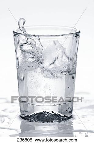 Close-up of water splashing into glass View Large Photo Image Stock Photography - Close-up of water splashing into glass . Fotosearch