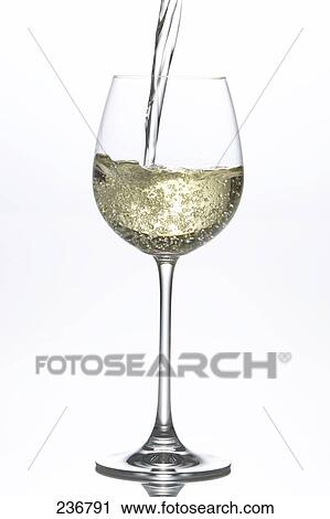 Close-up of white wine being poured into wine glass View Large Photo Image Stock Image - Close-up of white wine being poured into wine glass . Fotosearch
